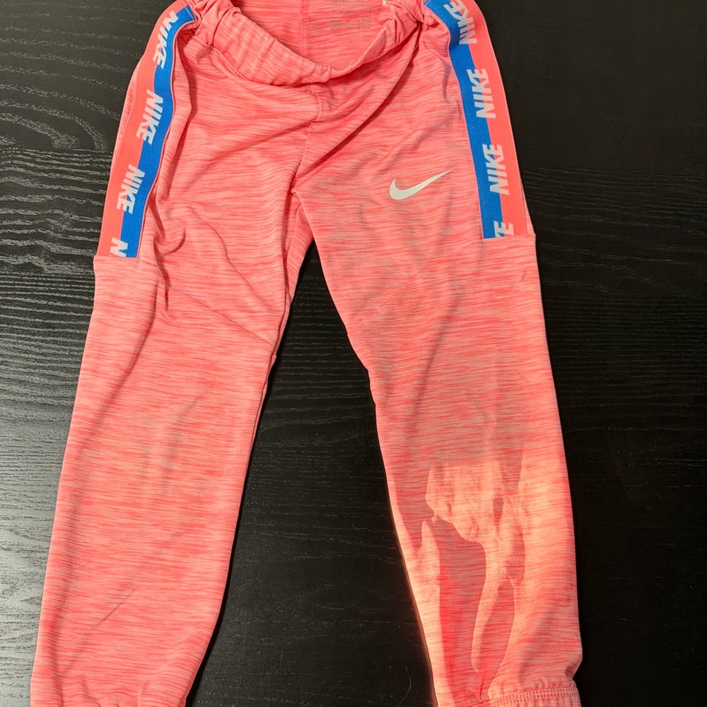 Nike Kids Coral Pink Joggers with Blue Logo Stripes